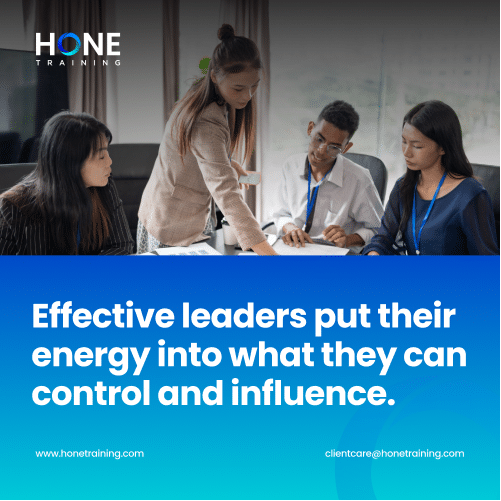 Group of four professionals collaborating at a table, with a bold blue gradient banner displaying a leadership slogan.