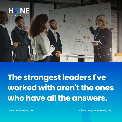 Team of professionals in a meeting listening to a presenter by a whiteboard; bottom banner shows the quote: 'The strongest leaders I've worked with aren't the ones who have all the answers.' Hone Training branding.