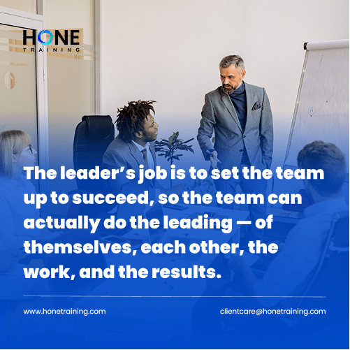 Leader presenting to a diverse team in a meeting, with a blue gradient overlay displaying a leadership quote.